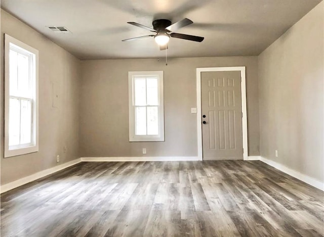 16204 Gaddy Rd, Shawnee, OK 74801 - unfurnished room with ceiling fan, baseboards, and dark wood-type flooring