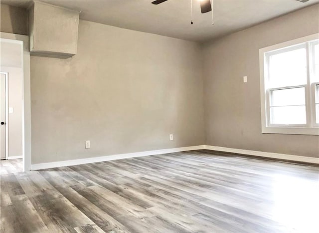 16204 Gaddy Rd, Shawnee, OK 74801 - unfurnished room with a ceiling fan, wood finished floors, and baseboards