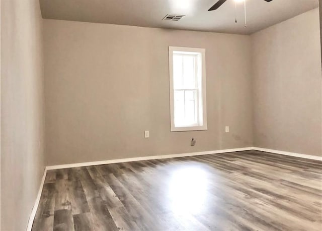 16204 Gaddy Rd, Shawnee, OK 74801 - spare room featuring a ceiling fan, wood finished floors, and baseboards