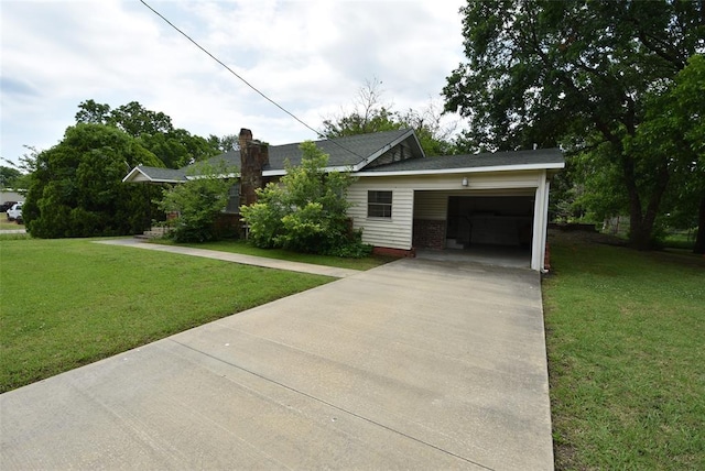 220 E Tiger Ave, Wetumka, OK 74883 - single story home featuring concrete driveway, an attached garage, a front lawn, and a chimney