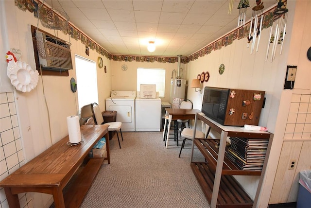 220 E Tiger Ave, Wetumka, OK 74883 - sitting room with washer and dryer, carpet floors, water heater, and an AC wall unit