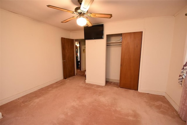 220 E Tiger Ave, Wetumka, OK 74883 - unfurnished bedroom with light carpet, a closet, ceiling fan, and ornamental molding