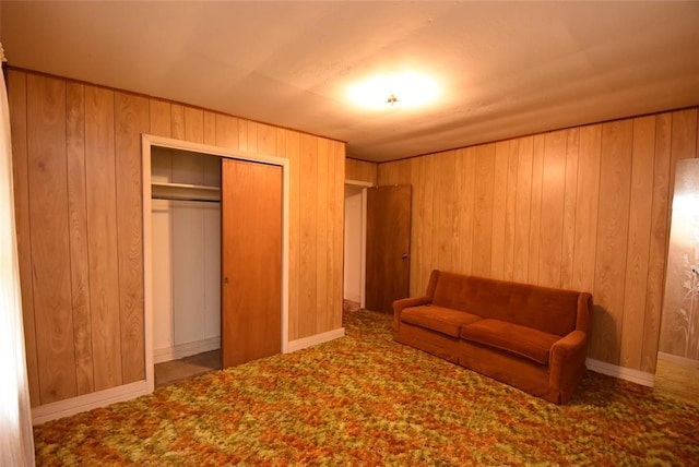 220 E Tiger Ave, Wetumka, OK 74883 - living area featuring wooden walls and carpet flooring