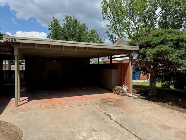 2125 Fremont Dr, The Village, OK 73120 - view of car parking with a carport