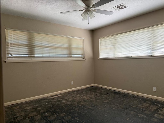 2125 Fremont Dr, The Village, OK 73120 - empty room featuring a ceiling fan and baseboards
