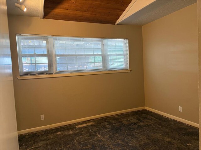 2125 Fremont Dr, The Village, OK 73120 - empty room with wood ceiling, plenty of natural light, baseboards, and lofted ceiling