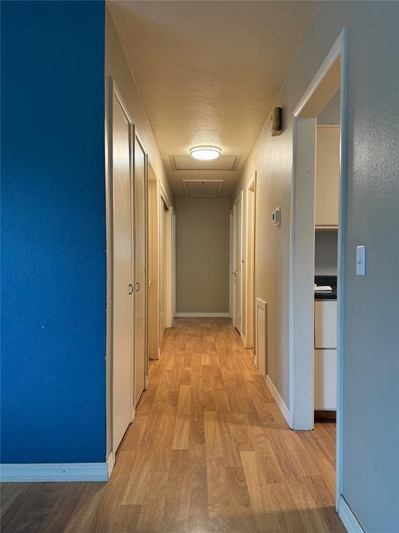 2125 Fremont Dr, The Village, OK 73120 - corridor with light wood-style flooring and baseboards