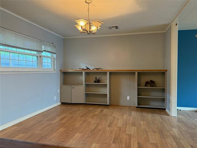 2125 Fremont Dr, The Village, OK 73120 - unfurnished room featuring light wood-type flooring, a chandelier, baseboards, and ornamental molding
