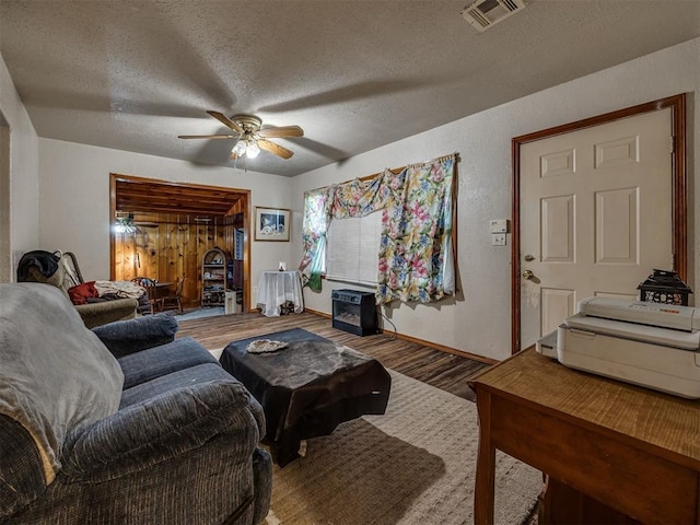3236 SW 37th St, Oklahoma City, OK 73119 - living area featuring ceiling fan, wood finished floors, a textured ceiling, and baseboards