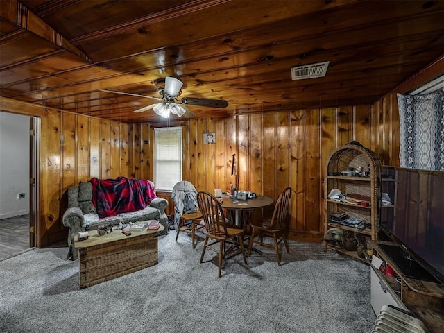 3236 SW 37th St, Oklahoma City, OK 73119 - carpeted dining area featuring ceiling fan, wooden walls, and wooden ceiling