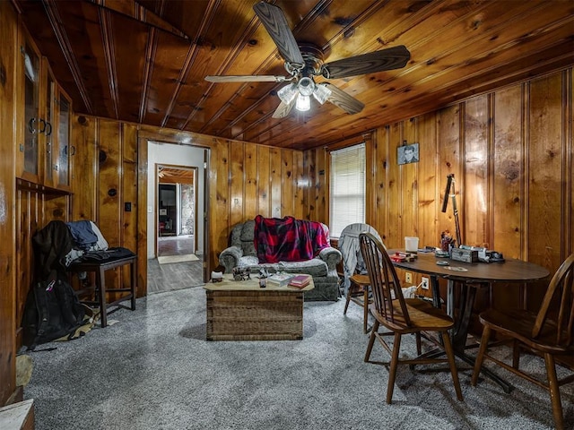 3236 SW 37th St, Oklahoma City, OK 73119 - living room featuring wooden ceiling, ceiling fan, and wooden walls