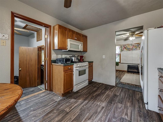 3236 SW 37th St, Oklahoma City, OK 73119 - kitchen featuring ceiling fan, white appliances, dark wood-type flooring, and brown cabinetry