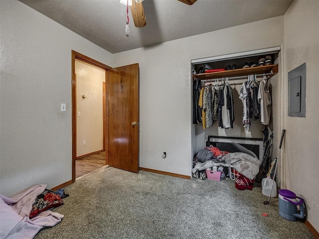 3236 SW 37th St, Oklahoma City, OK 73119 - carpeted bedroom with electric panel, baseboards, a closet, and a ceiling fan
