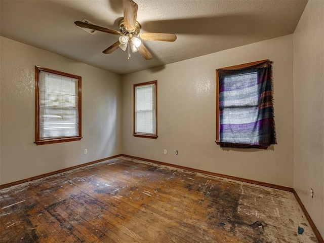 3236 SW 37th St, Oklahoma City, OK 73119 - unfurnished room featuring plenty of natural light, ceiling fan, and baseboards