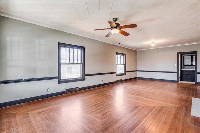 816 W Padon St, Blackwell, OK 74631 - spare room featuring a ceiling fan, crown molding, and baseboards