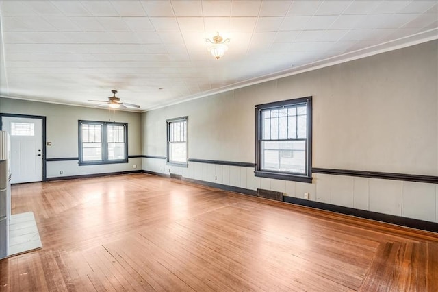 816 W Padon St, Blackwell, OK 74631 - unfurnished room with ornamental molding, hardwood / wood-style flooring, and ceiling fan