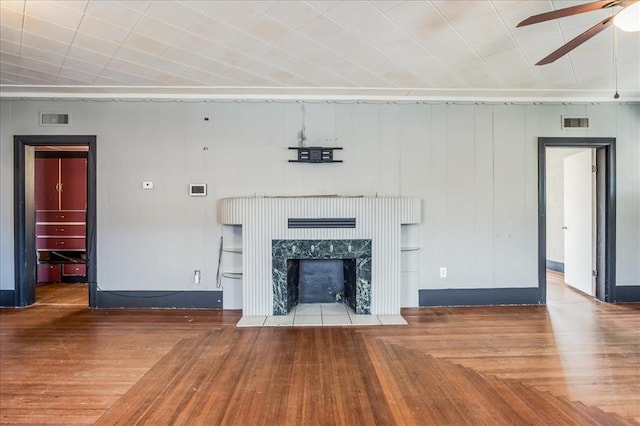 816 W Padon St, Blackwell, OK 74631 - unfurnished living room with ceiling fan, a premium fireplace, parquet flooring, and baseboards