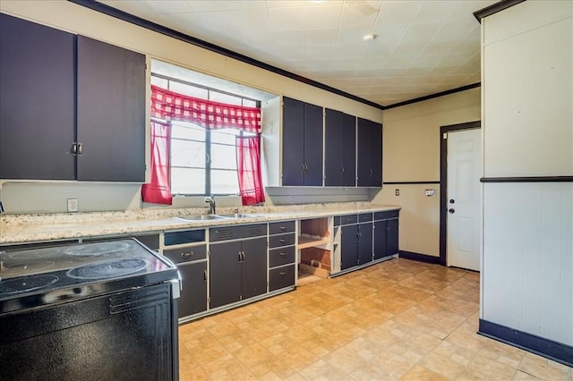 816 W Padon St, Blackwell, OK 74631 - kitchen featuring a sink, light countertops, electric range, light flooring, and ornamental molding
