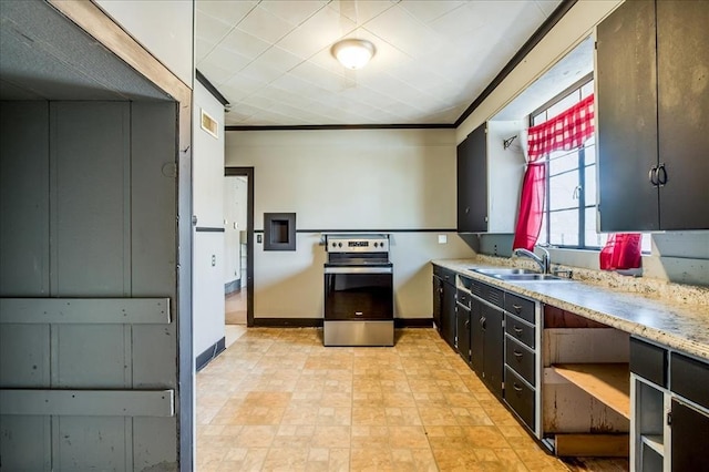 816 W Padon St, Blackwell, OK 74631 - kitchen featuring stainless steel electric range, a sink, light countertops, and baseboards