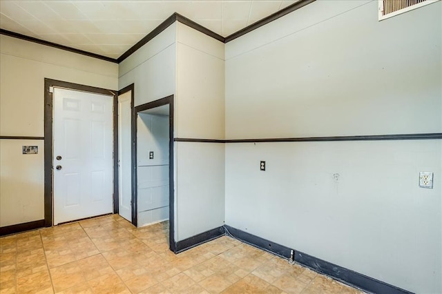 816 W Padon St, Blackwell, OK 74631 - spare room featuring crown molding and baseboards