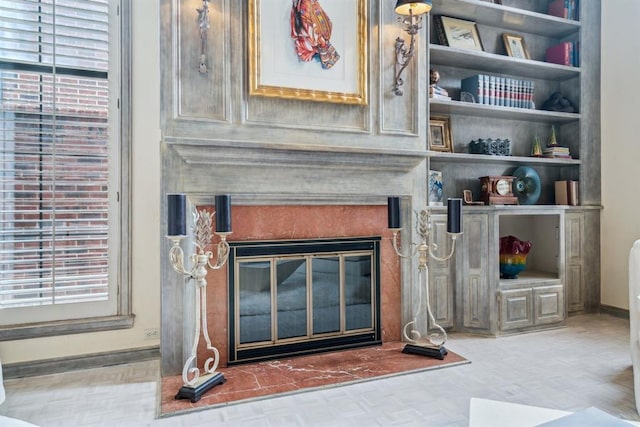 6206 Waterford Blvd Unit 78, Oklahoma City, OK 73118 - detailed view of baseboards, a glass covered fireplace, and wood finished floors