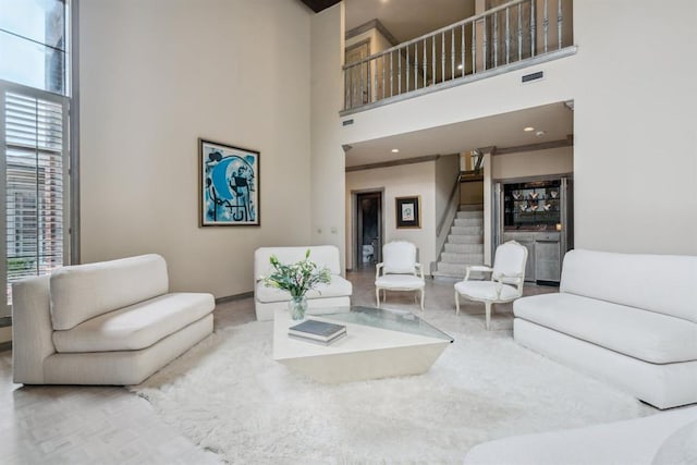 6206 Waterford Blvd Unit 78, Oklahoma City, OK 73118 - living room with a high ceiling, stairway, baseboards, and recessed lighting