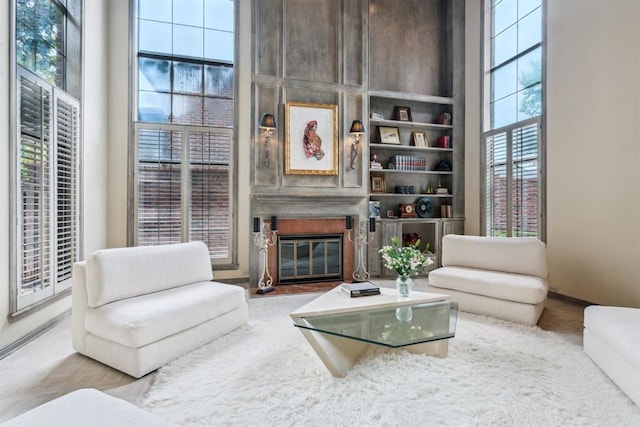 6206 Waterford Blvd Unit 78, Oklahoma City, OK 73118 - living area featuring a fireplace, baseboards, and built in shelves