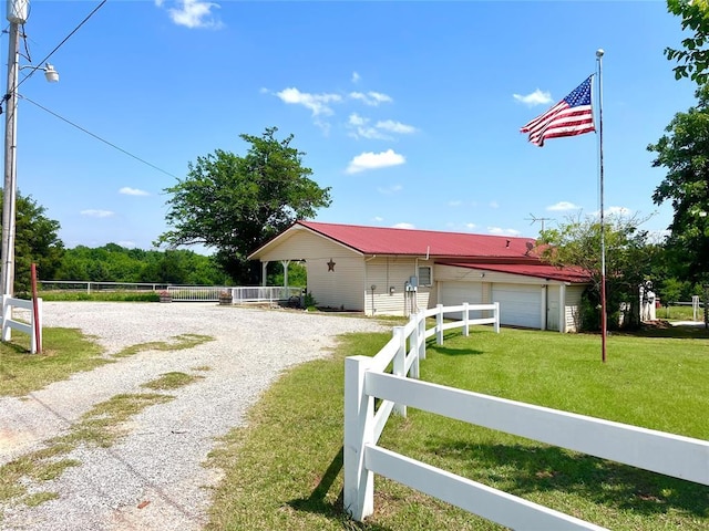 416 E Quail Rd, Chickasha, OK 73018 - ranch-style home featuring driveway, a garage, and metal roof