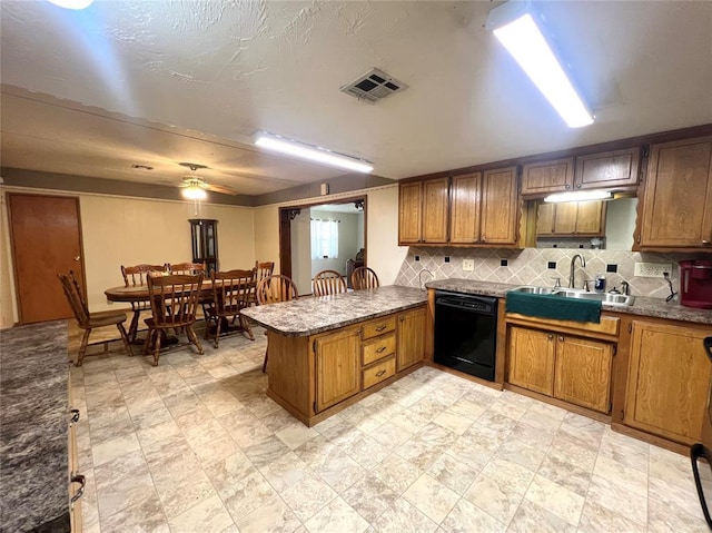 416 E Quail Rd, Chickasha, OK 73018 - kitchen featuring dishwasher, a sink, a peninsula, and backsplash