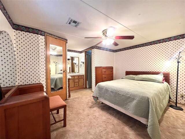 416 E Quail Rd, Chickasha, OK 73018 - bedroom featuring wallpapered walls, light carpet, and ceiling fan