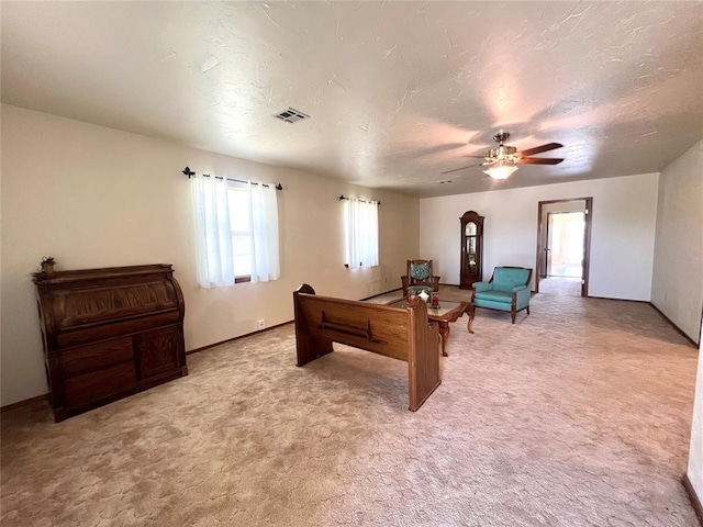 416 E Quail Rd, Chickasha, OK 73018 - playroom featuring ceiling fan, light carpet, a textured ceiling, and baseboards