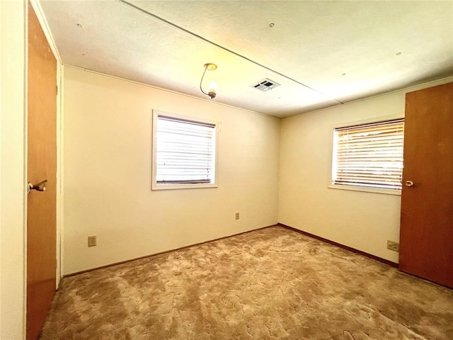 416 E Quail Rd, Chickasha, OK 73018 - carpeted spare room with healthy amount of natural light and baseboards