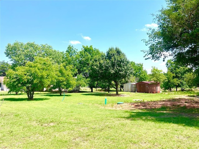 416 E Quail Rd, Chickasha, OK 73018 - view of green lawn featuring an outbuilding
