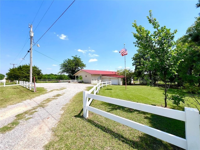 416 E Quail Rd, Chickasha, OK 73018 - ranch-style house featuring gravel driveway and an outbuilding