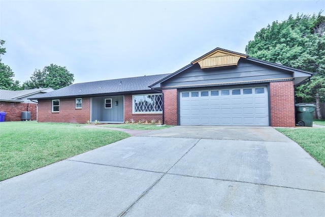 336 N Sherry Ave, Norman, OK 73069 - ranch-style house featuring brick siding, driveway, and a front yard