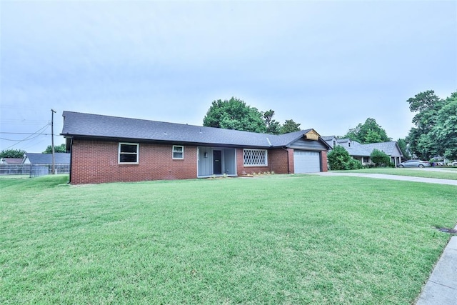 336 N Sherry Ave, Norman, OK 73069 - ranch-style home with a garage, brick siding, and driveway