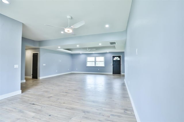336 N Sherry Ave, Norman, OK 73069 - spare room with a ceiling fan, a tray ceiling, light wood-style floors, and recessed lighting