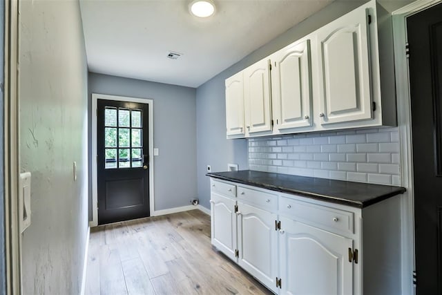 336 N Sherry Ave, Norman, OK 73069 - laundry area featuring cabinet space, light wood finished floors, and washer hookup