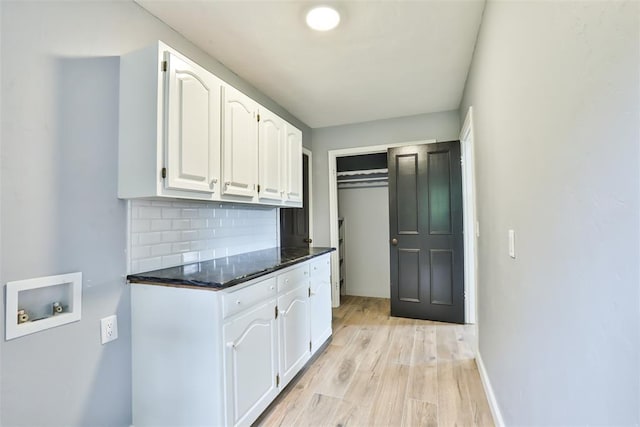 336 N Sherry Ave, Norman, OK 73069 - laundry room with cabinet space, washer hookup, and light wood finished floors