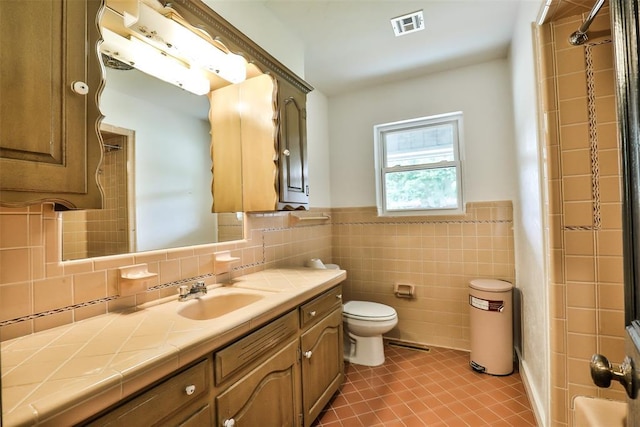 336 N Sherry Ave, Norman, OK 73069 - full bathroom featuring vanity, tile walls, tile patterned flooring, and a wainscoted wall