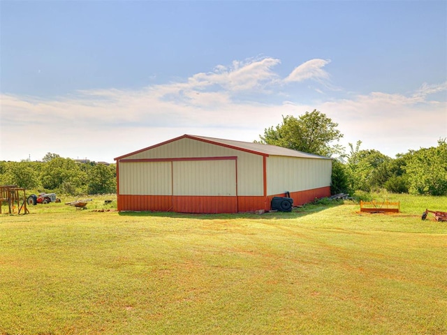 19108 Finn Ridge Rd, Purcell, OK 73080 - view of home's exterior with an outbuilding, a lawn, and a garage