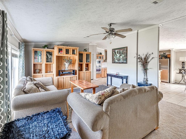19108 Finn Ridge Rd, Purcell, OK 73080 - living area featuring crown molding, a ceiling fan, a textured ceiling, and light tile patterned floors