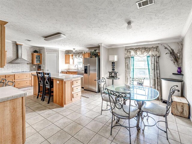 19108 Finn Ridge Rd, Purcell, OK 73080 - dining room with crown molding, healthy amount of natural light, a textured ceiling, and light tile patterned floors