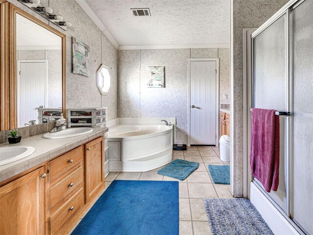 19108 Finn Ridge Rd, Purcell, OK 73080 - bathroom featuring crown molding, tile patterned floors, a bath, double vanity, and a shower stall