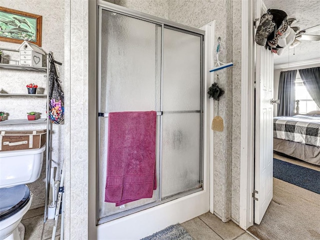19108 Finn Ridge Rd, Purcell, OK 73080 - full bathroom featuring ensuite bathroom, toilet, a shower stall, wallpapered walls, and a ceiling fan