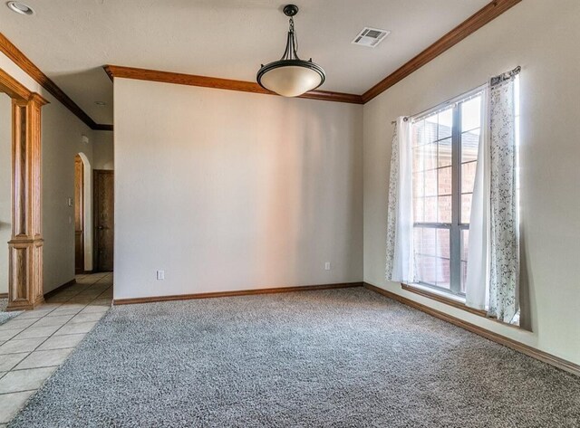 5704 Bent Creek Dr, Oklahoma City, OK 73135 - unfurnished room featuring crown molding, arched walkways, light colored carpet, and baseboards