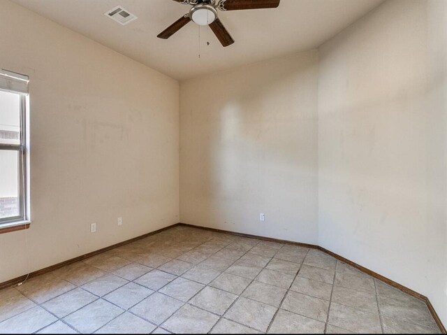 5704 Bent Creek Dr, Oklahoma City, OK 73135 - empty room featuring ceiling fan, baseboards, and light tile patterned floors