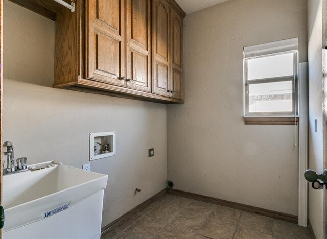 5704 Bent Creek Dr, Oklahoma City, OK 73135 - laundry room featuring cabinet space, hookup for a washing machine, electric dryer hookup, and baseboards