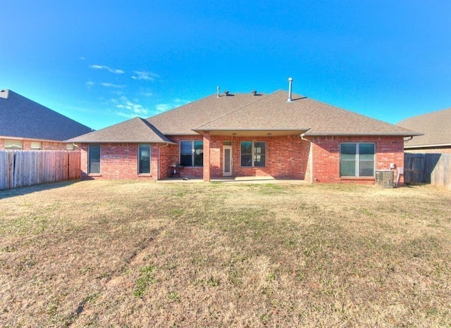 5704 Bent Creek Dr, Oklahoma City, OK 73135 - rear view of house with brick siding, a shingled roof, and a patio area
