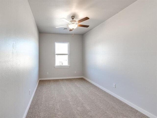813 Stella Trl, Guthrie, OK 73044 - empty room with a ceiling fan, light carpet, and baseboards